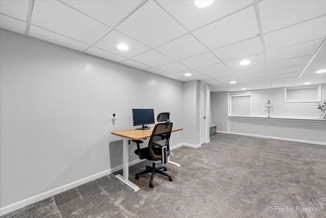 carpeted office featuring a paneled ceiling