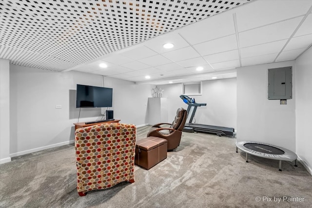 interior space featuring electric panel, a drop ceiling, and carpet