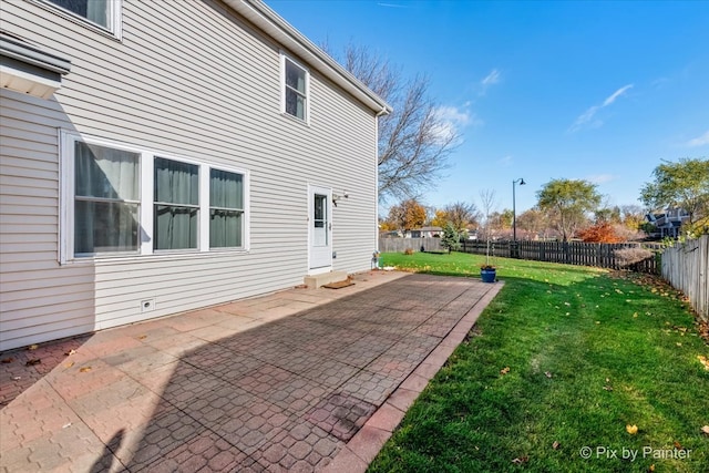 exterior space featuring a yard and a patio