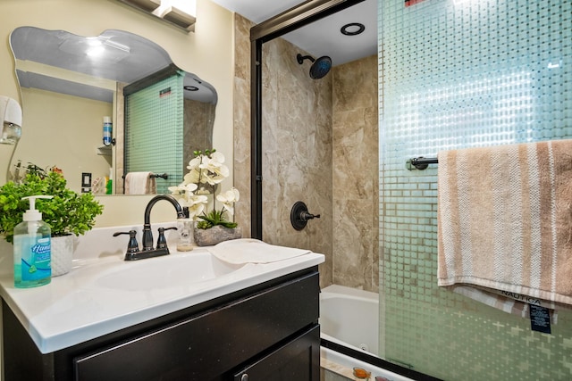 bathroom featuring vanity and tiled shower / bath combo