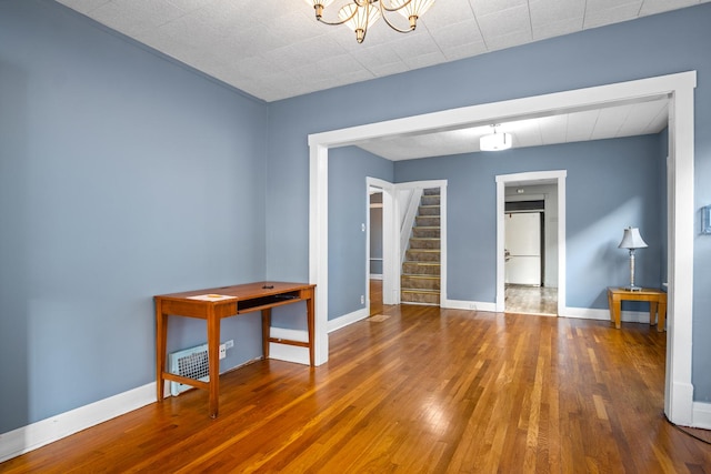 empty room with wood-type flooring