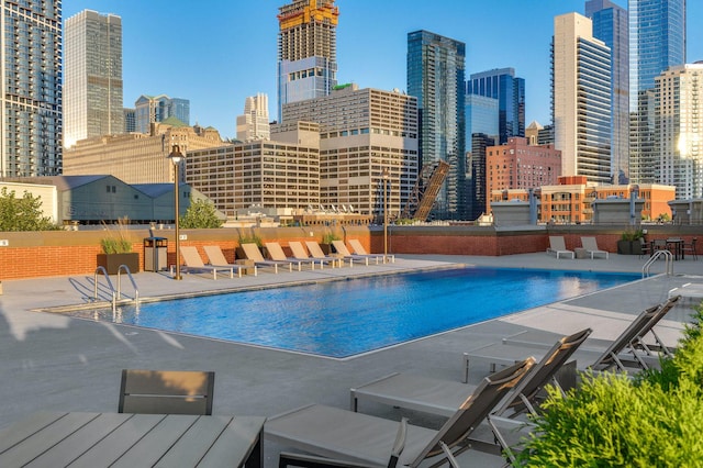 view of swimming pool featuring a patio area