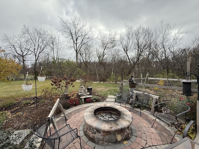 view of patio / terrace featuring an outdoor fire pit