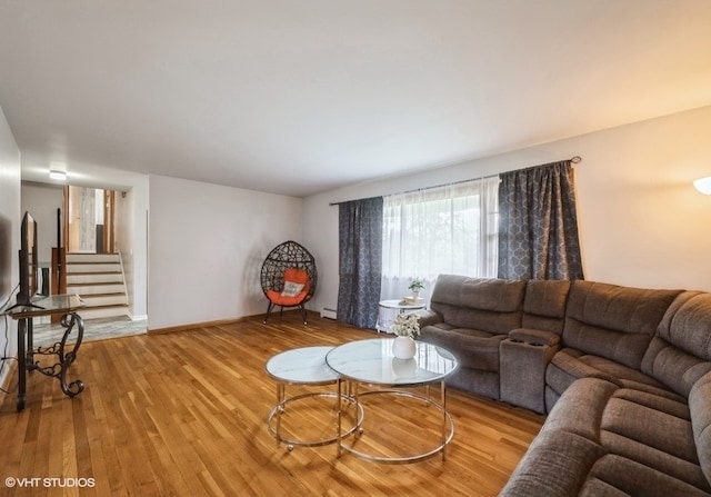 living room featuring hardwood / wood-style floors and a baseboard radiator