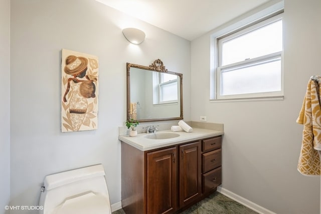 bathroom with vanity and toilet