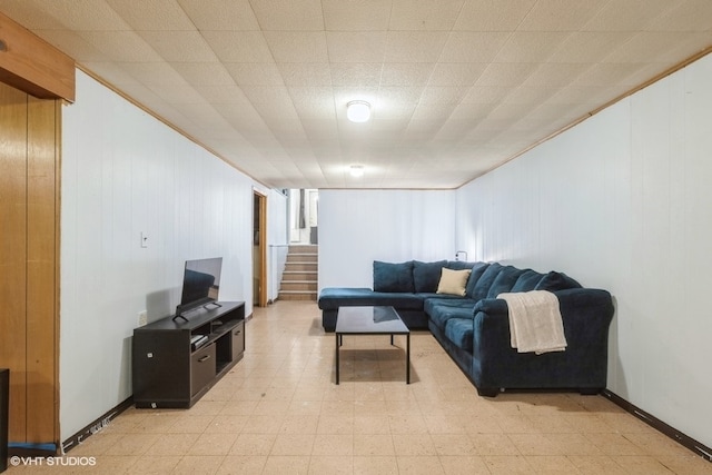 living room with wood walls