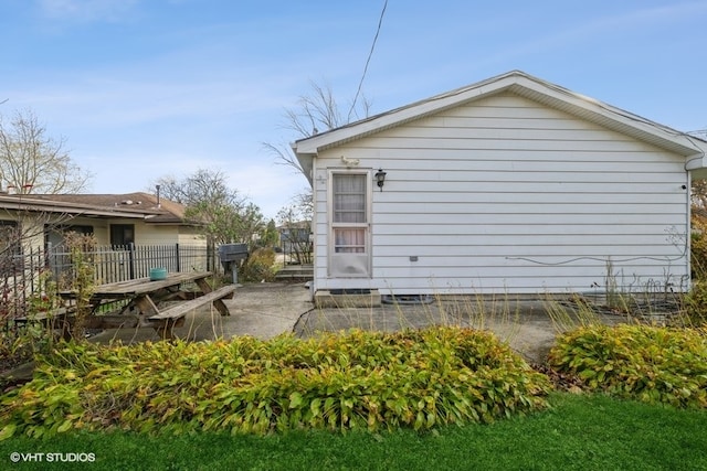 view of property exterior with a patio