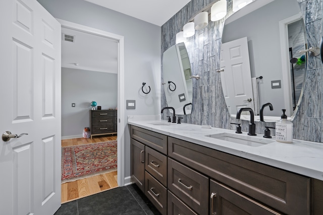 bathroom with hardwood / wood-style floors and vanity