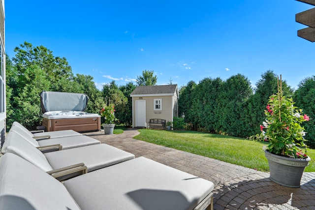 view of patio / terrace featuring an outdoor structure and a hot tub