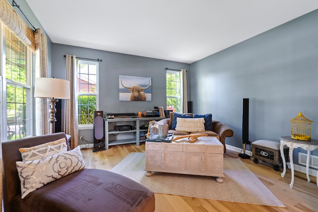 living room with light hardwood / wood-style flooring