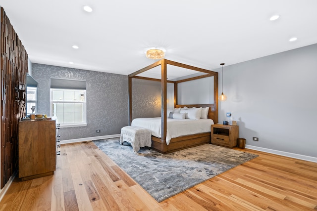 bedroom with hardwood / wood-style floors