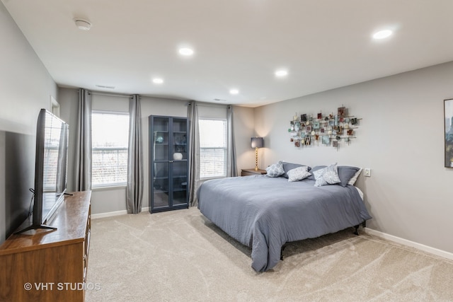 bedroom featuring light carpet