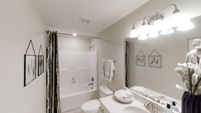 full bathroom with shower / tub combo, vanity, and toilet