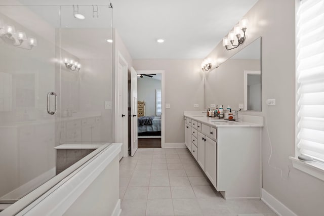 bathroom with tile patterned flooring, vanity, and an enclosed shower