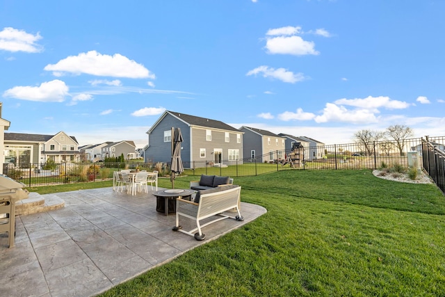 view of home's community with a yard and a patio