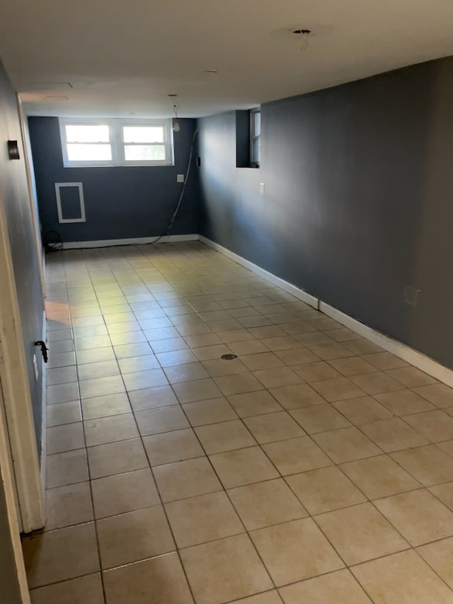 basement with light tile patterned flooring