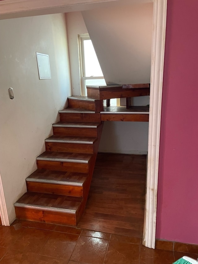 stairway with hardwood / wood-style floors