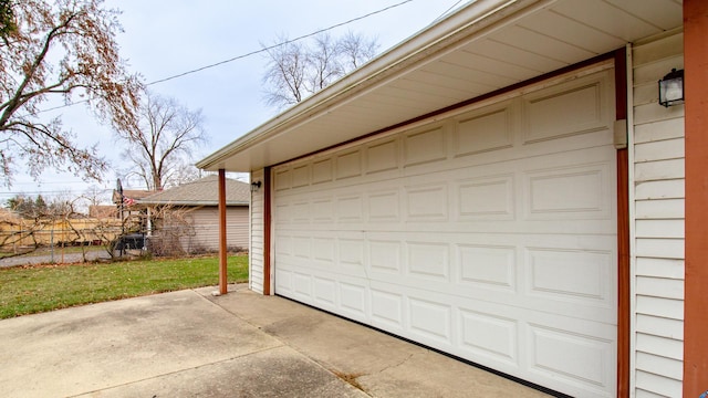 garage featuring a lawn