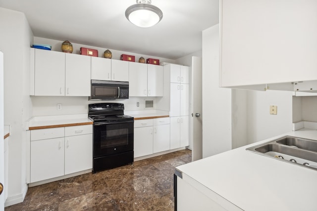 kitchen with white cabinetry and black appliances