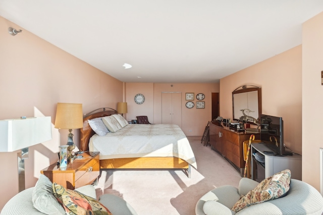 bedroom with light colored carpet