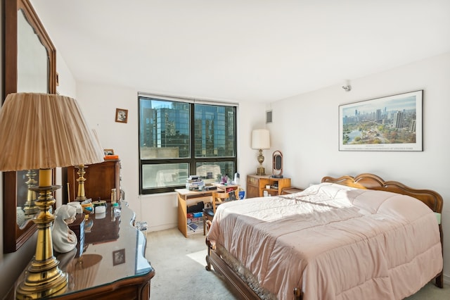 bedroom featuring light colored carpet