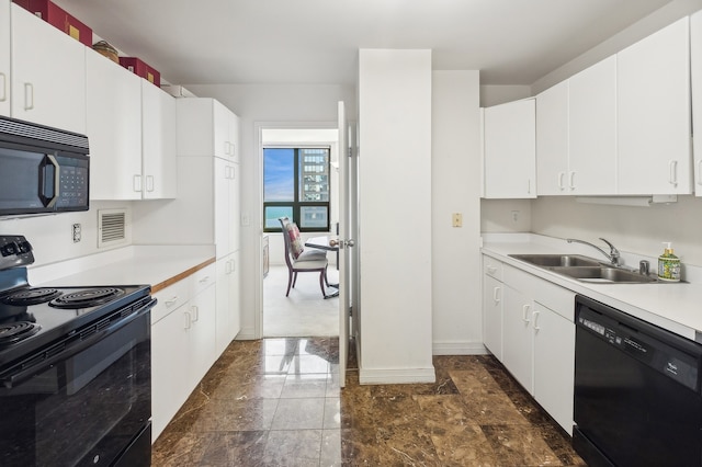 kitchen featuring white cabinets, sink, and black appliances