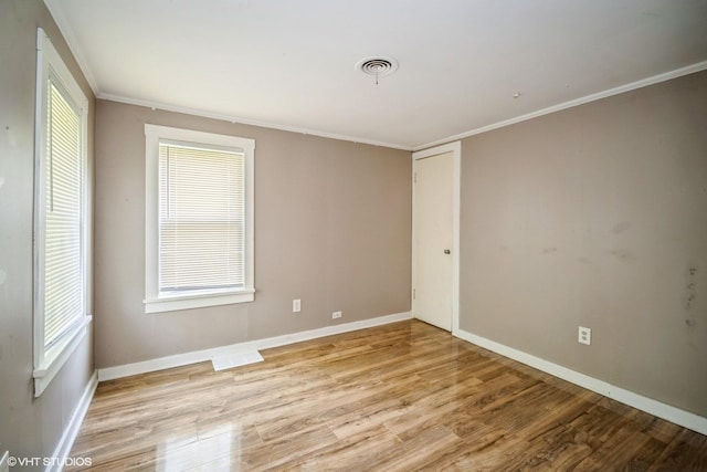 23525 W Briar Ter, Antioch, IL 60002 - unfurnished room with light wood-style flooring, crown molding, and baseboards