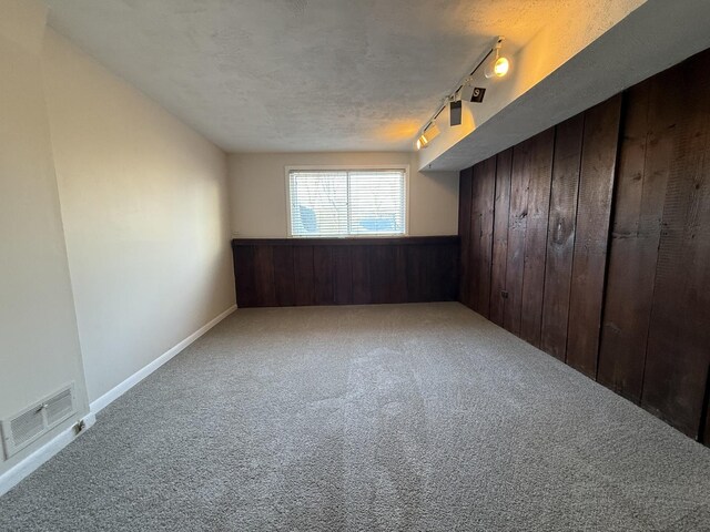 bedroom featuring a closet, ceiling fan, carpet flooring, and a baseboard radiator