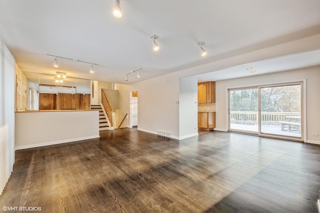 unfurnished living room with dark hardwood / wood-style floors