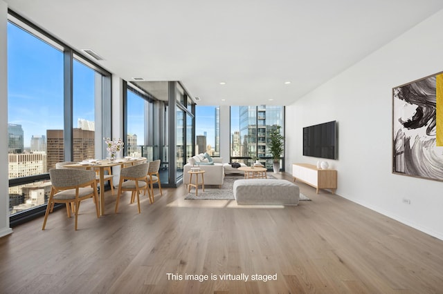 interior space with hardwood / wood-style flooring and a wall of windows