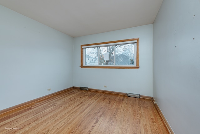 unfurnished room with light hardwood / wood-style flooring