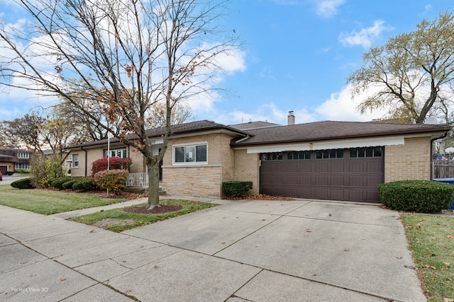 single story home with a front lawn and a garage