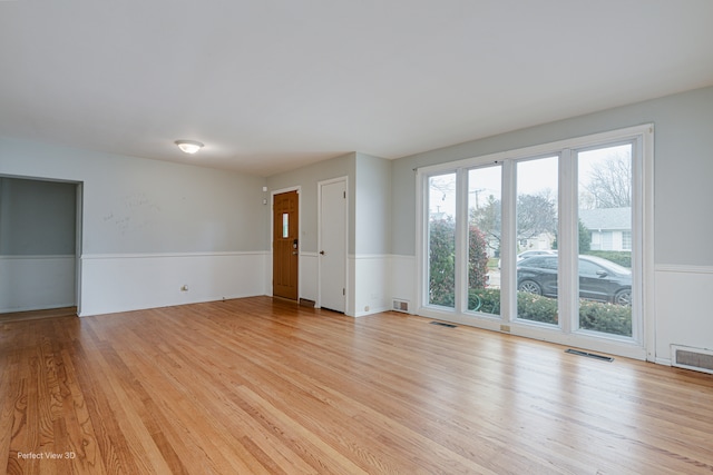 unfurnished room featuring light hardwood / wood-style flooring