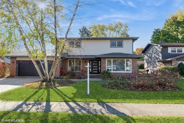 front of property featuring a garage and a front yard