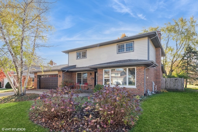 view of property with a front lawn and a garage