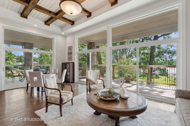 interior space featuring beam ceiling and wood finished floors