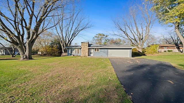 single story home with a garage and a front yard