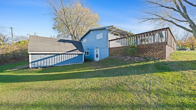 view of yard with a wooden deck and a storage unit