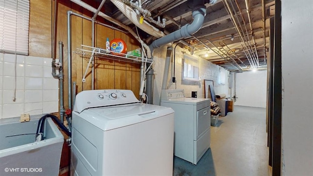 laundry area with independent washer and dryer