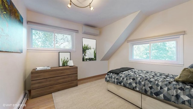 bedroom featuring baseboard heating, light hardwood / wood-style flooring, and an AC wall unit