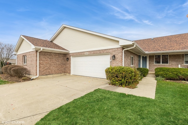 view of front of house with a front yard and a garage