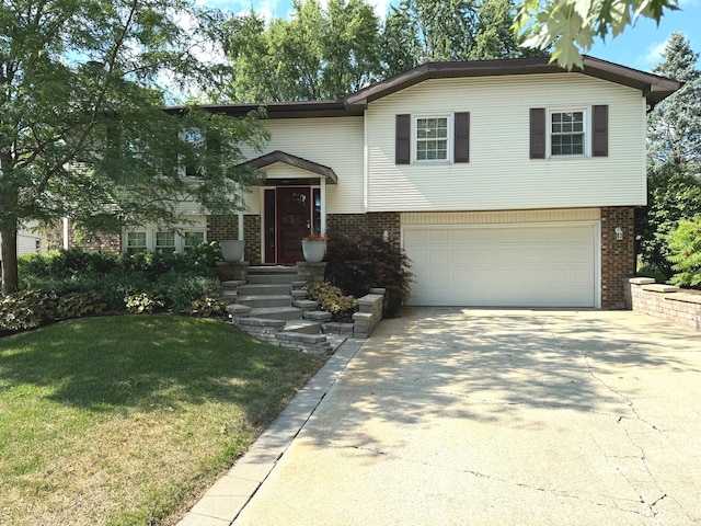 view of front facade with a garage and a front yard