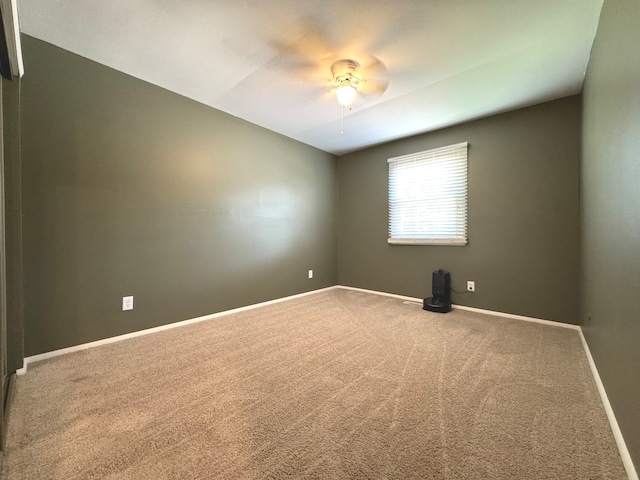 carpeted empty room with ceiling fan