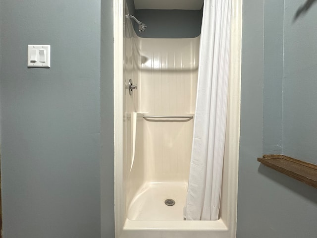 bathroom with a shower with shower curtain