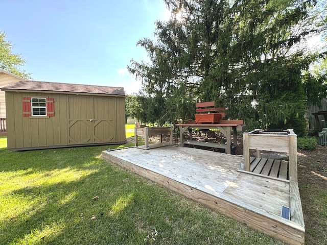 exterior space featuring a lawn and a storage unit