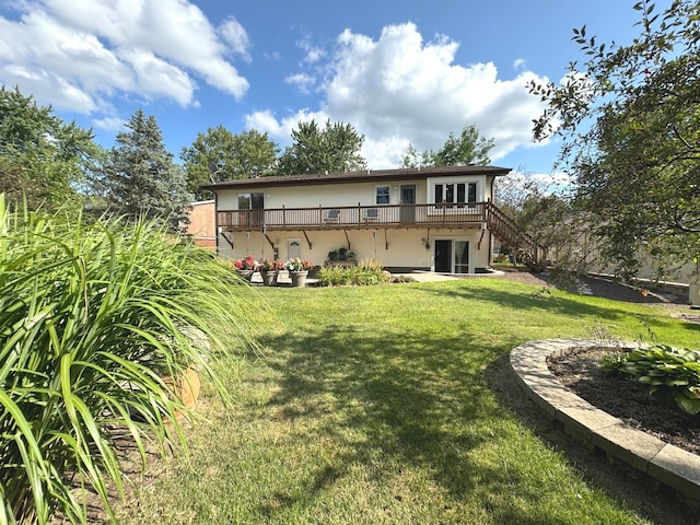 rear view of house with a yard