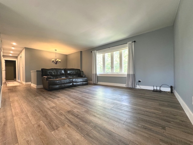 living room featuring hardwood / wood-style flooring and a notable chandelier