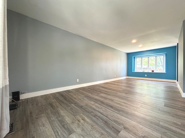 spare room with hardwood / wood-style floors