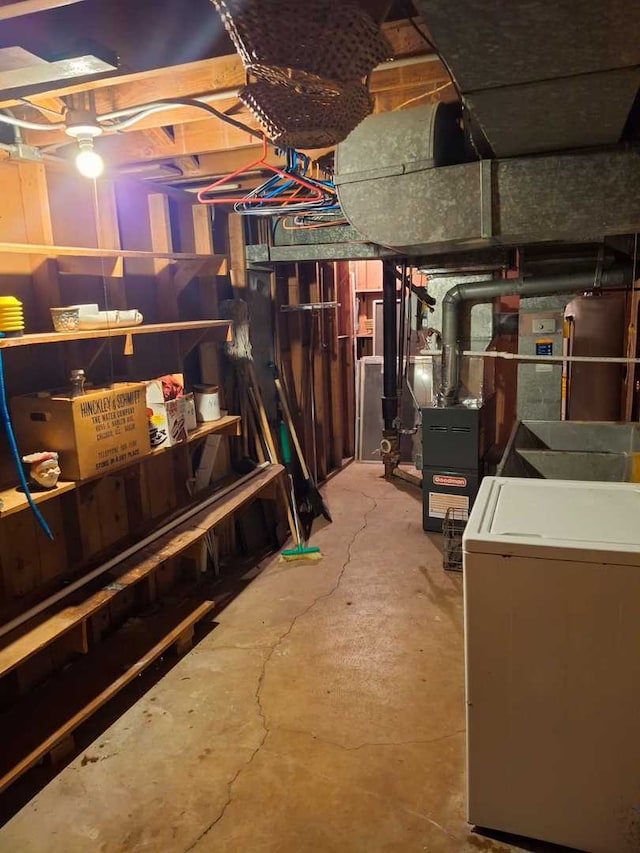 basement with washer / clothes dryer and heating unit