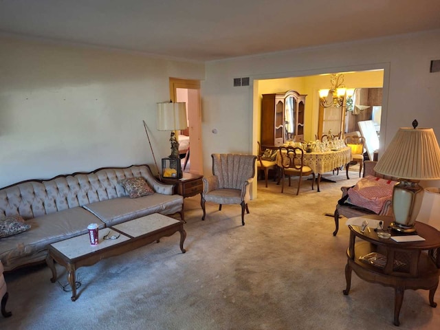 carpeted living room featuring an inviting chandelier